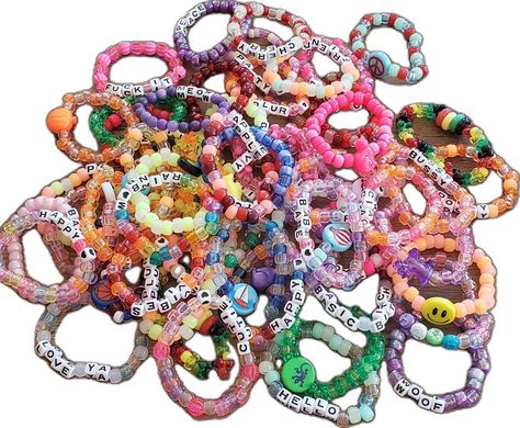 A pile of 50 assorted kandi singles. Beaded friendship bracelets shown are random, some with glow in the dark beads, phrases /  words, and some with charms. Beaded kandi bracelets in a variety of bead colors Bracelets Fall, Fall Bracelets, Kandi Singles, Glow In The Dark Beads, Bracelets Kandi, Bracelets Friendship, Autumn Bracelet, Kandi Bracelets, Thousand Oaks