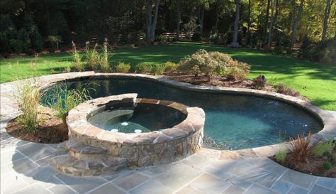 600 Sq. Ft. pool/spa combo with custom stepping stone coping and a bluestone patio. This pool has a Midnight Blue PebbleTec finish. Pool Spa Combo, Patio Redo, Lanai Ideas, Small Hot Tub, Pool Landscaping Ideas, Kidney Shaped Pool, Yard Diy, Pool Images, Pools Backyard Inground