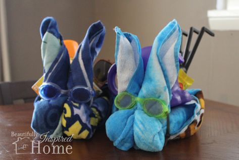 Easy tutorial to make your own beach towel Easter bunny basket. All you need is a towel, rubber band, and goggles to make this cute Easter gift. Beach Towel Easter Basket, Towel Easter Baskets, Charity Ideas, Creative Easter Baskets, Easter Bunny Basket, Bunny Basket, Easter Basket Diy, Sweet Summertime, Diy Basket