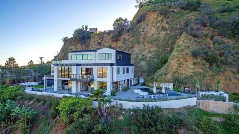 The home's location is worth the risk. Landscaping Between Neighbors, Hollywood Hills Homes, Home Economics, Hollywood Hills, Montego Bay, House On A Hill, Celebrity Houses, Ceiling Windows, Demi Lovato