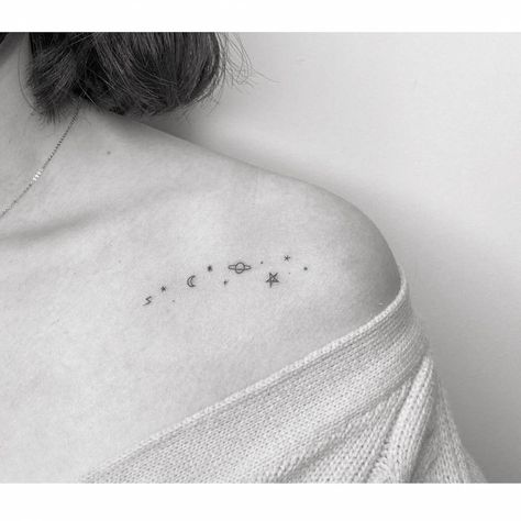 Minimalist galaxy tattoo on the shoulder Simple Galaxy Tattoo, Planet Tattoos Simple, Small Galaxy Tattoo, Planets Tattoo Design, Puzzle Piece Tattoos, Galaxy Tattoo Ideas, Collar Bone Tattoos For Women, Galaxy Tattoos, Puzzle Tattoos