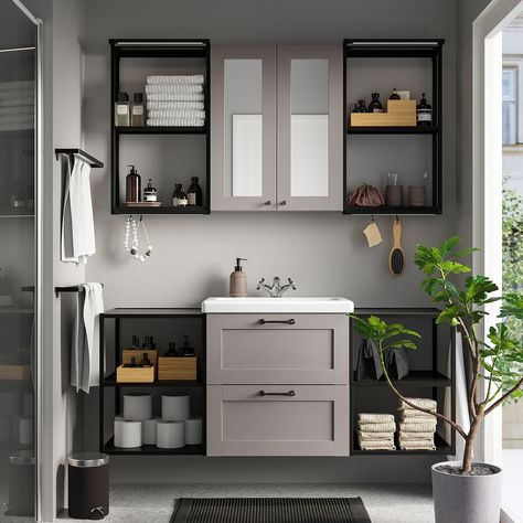 With grey as a base, you create a warm and cosy feeling. Perfect if you want a discreet colour that goes with everything. Modern or classic – you decide the style. The unique wedge dowels make assembly easy and the fittings are nearly invisible. You can easily add ENHET accessories to extend the use of your storage combination. And best of all – you don’t have to drill. Sold separately. This combination offers a harmonious mix of open and closed storage with lots of space to place the things oft Compact Bathroom Design, Small Bathroom Interior, Small Bathroom Sinks, Compact Bathroom, Ikea Bathroom, Basin Design, Mirror Cabinet, Grey Bathrooms, Small Bathroom Decor