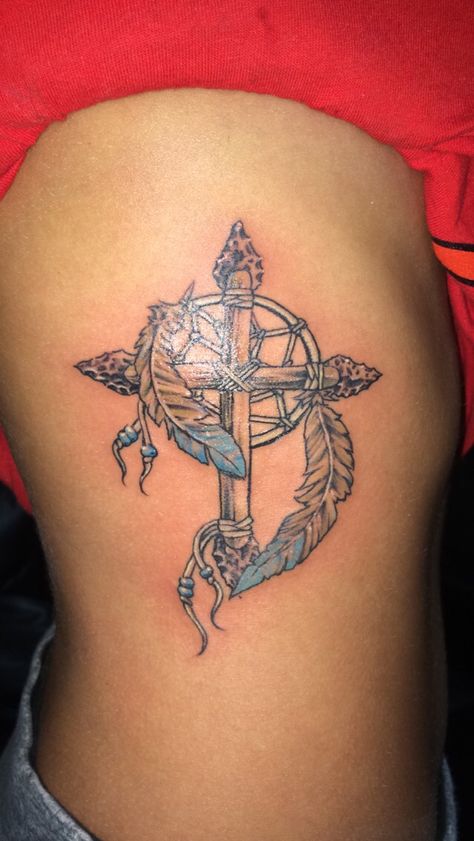 Cherokee Cross #cross tattoo #dream catcher #rib tattoo #first tattoo Cherokee Indian Tattoos, Cherokee Tattoos, Trible Tattoos, Indian Skull Tattoos, Indian Feather Tattoos, Ankle Bracelet Tattoo, Cowboy Tattoos, Native Tattoos, Cross Tattoos For Women