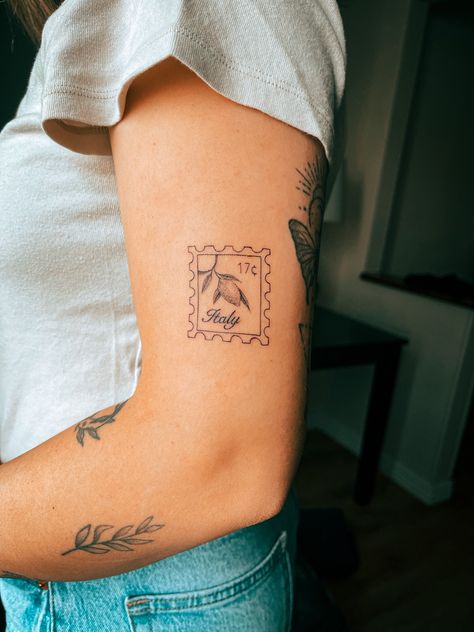 Fine line detailed Italy lemon stamp tattoo on arm Lemon Stamp, Cleveland Tattoo, Italy Stamp, Italy Tattoo, Stick And Poke Tattoo, Stamp Tattoo, Small Girly Tattoos, Hibiscus Tattoo, Different Tattoos