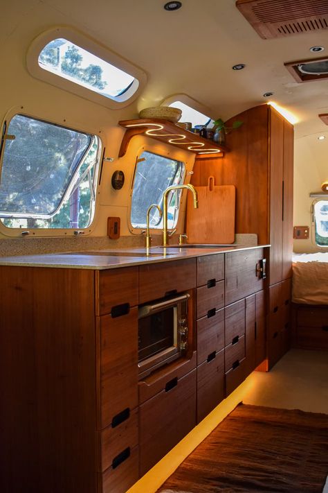 Photo 10 of 15 in Budget Breakdown: He Singlehandedly Gave a ’76 Airstream a Redwood Reinvention for $180K - Dwell Mid Century Modern Airstream, Airstream Outdoor Space, Air Stream Remodel, Airstream Living, Action Board, Glamper Camper, Airstream Remodel, Airstream Interior, Camper Trailer Remodel