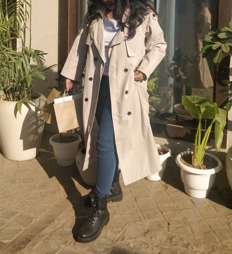 Beige Trench Coat Outfit, Styling trench coat with blue skinny jeans and black boots Winter season is here! For a brunch date I went for a minimalist look. Embracing the sunlight, I styled my Beige Trench coat with white sando innerwear, skinny dark blue jeans, and black boots. A perfect outfit for a cutesy date. Beige Trench Coat Outfit, Styling trench coat with blue skinny jeans and black boots Black Boots Winter Outfit, Styling Trench Coat, Beige Trench Coat Outfit, Trench Coat Outfit Winter, White Sando, Boots Winter Outfit, Combat Boot Outfit, Black Coated Jeans, Winter Coat Outfits