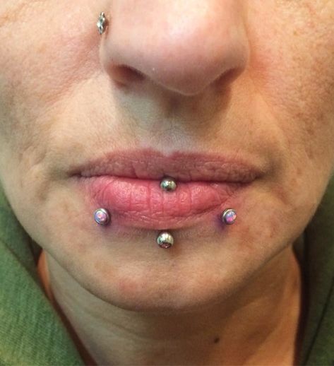 Fresh pair of snake bites, both with 4mm purple opals by @mollymaemoon 💜🐍💜🐍💜 #piercingsbymollymoon #mollymoon #mollymoons #piercings #piercing #snakebites #snakebitespiercing #lippiercings #opal #purple #lips #lipstick #piercedgirls #uwo #oshkosh #foxvalley #920tattoocompany #920tattoo #920tattooco #downtownoshkosh #thisisoshkosh Vertical Labret Piercing, Vertical Labret, Snakebites, Purple Opal, Piercings For Girls, Purple Lips, Labret Piercing, Snake Bites, Body Piercings