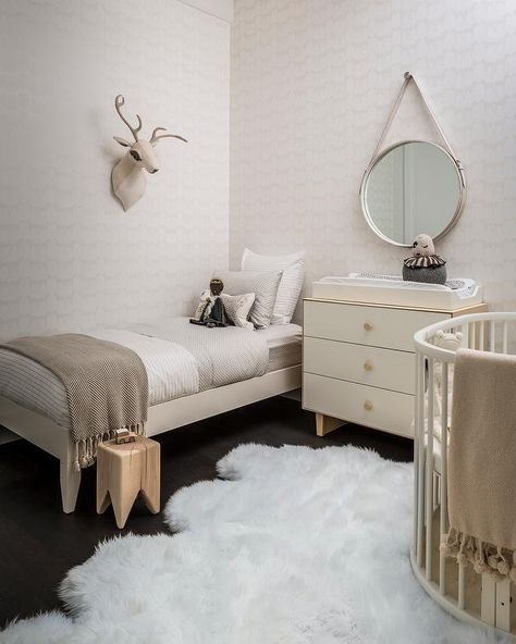 Nursery that doubles as bedroom... May not be possible with twins...  Fun boy's nursery features an ivory oval crib dressed in neutral crib bedding atop a white sheepskin pelt. Transitional Nursery, Shared Nursery, Neutral Room, Shared Room, Kids Interior, Baby's Room, Nursery Inspiration, Cozy Interior, Toddler Room