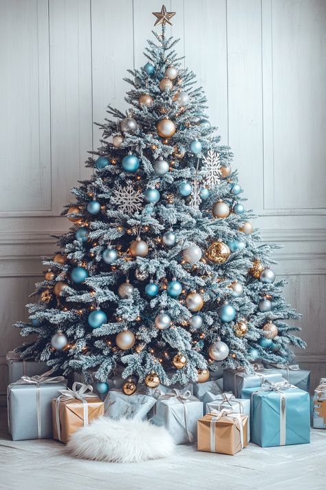 Light blue and gold Christmas tree with silver ornaments, white fur garland, and presents, set against gray shiplap walls. Christmas Tree Snowflake Theme, Blue And Gold Christmas Tree, Blue Gold Christmas, Blue And Gold Christmas, Gray Shiplap, Farmhouse Christmas Decor Ideas, Frosted Christmas Tree, Santa And His Reindeer, Christmas Planters