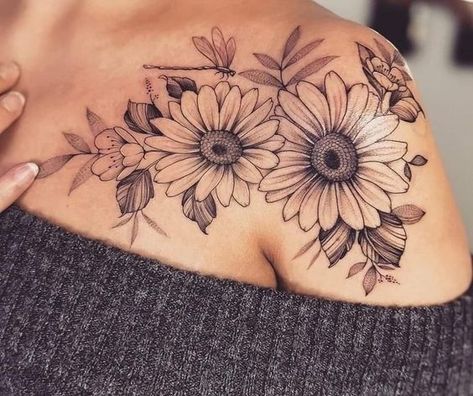 Flower Tattoos Daisies, Shoulder Daisy Tattoo, Shoulder Flower Tattoos For Women Colour, Upper Arm Shoulder Tattoo, Black And White Daisy Tattoo, Sunflower And Daisy Tattoo, Daisy Tattoos For Women, Shoulder And Upper Arm Tattoos For Women, Cover Up Tattoo Designs For Women