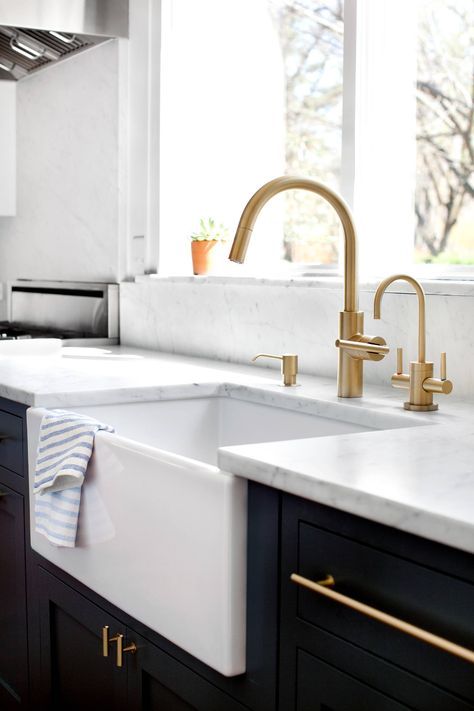 Love the gold fixtures (not the way the sink sticks out). Would like the main faucet and the instant hot and filtered water tap too. Kitchen Renovation Design, Farmhouse Sink Faucet, Gold Faucet, Snake Oil, Sink Ideas, Farmhouse Kitchen Remodel, Two Tone Kitchen, Unique Farmhouse, Gold Kitchen