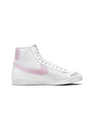 The Nike Blazer Mid '77 channels the old-school look of Nike basketball with a vintage midsole finish. Throwback style with modern materials means you can run, skip and jump in comfort. Shown: Summit White/Coconut Milk/Honeydew/Pink Foam Style: DA4086-106 Pink Nike Blazers, Nike Blazers, Blazers Shoes, Nike High Tops, Nike Blazer Mid 77, Nike Blazer Mid, Nike Blazers Mid, Shoes Teen