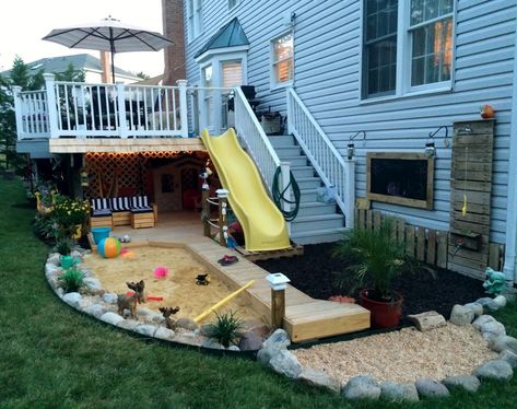 25 Awe-Inspiring DIY Sandbox Ideas for a Fun-Filled Summer Playtime Backyard Patio Designs With Playground, Backyard For Family, Deck Slide Ideas, Backyard Kiddie Pool Ideas Play Areas, Outside Play Area Ideas, Ultimate Kids Backyard, Under The Deck Play Area For Kids, Slide On Deck, Under Deck Play Area Kids