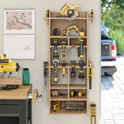 Unleash the potential of your garage with the 48" extra large vertical wall mount tool organizer. With its grain-free stability, the MDF construction surpasses solid wood by resisting expansion and contraction in hot and cold climates, ensuring longevity without warping. This exceptional durability guarantees a haven for your tools without any risk of dings or nicks to edges and blades that can be found when using metal alternatives. The tool organizer holds up to 8 drills, hammers, hand tools, Small Garage Tool Organization, Garage Storage And Man Cave, Power Tool Storage Diy, Screw Storage Ideas, French Cleat Tool Storage, Tool Wall Storage, Garage Wall Storage, Tool Wall, Workshop Shed