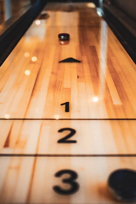 Shuffleboard is a popular game played on a very long and expansive table, which most people would struggle to fit in their home. The regulation size table for this game is 22 feet long and 30 inches wide; however, you can get much smaller varieties so that you can play shuffleboard in the comfort of your own home. Shuffleboard Basement, Aesthetic Game Room, Closet Rod Height, Shuffle Boards, Shuffle Board, Painted Closet, Shuffleboard Tables, Craft Food, Shower Plumbing