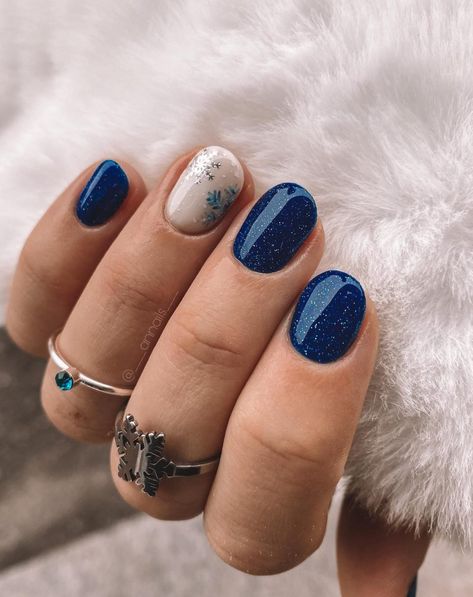 50 Winter Nail Designs You'll Want To Try Pretty Gel Nails Winter, Christmas Shellac Nails Winter, New Year's Nails Glitter, January Cruise Nails, Winter Nails 2023 Trends Blue, Short Nail Designs January, New Year Blue Nails, Shellac Nail Designs Winter, Winter Shellac Nail Designs