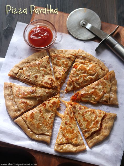 Heat dosa tawa,carefully place the paratha on the tawa.Drizzle oil and cook on both the sides Pizza Paratha Recipe, Pizza Paratha, Roti Pizza, Veg Snacks, Paratha Recipe, Breakfast Recipes Indian, Recipe Vegetarian, Paratha Recipes, Indian Bread