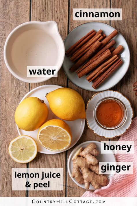 This homemade lemon ginger cinnamon tea is great to warm up on a cold day and an excellent recipe when you’re feeling under the weather. It’s easy to make with 5 ingredients and great for soothing a sore throat. The recipe is super easy to make. Just steep the cinnamon, ginger, and lemon peel, and then stir in the honey and lemon juice. Create variations with orange, turmeric, maple syrup, elder berries, thyme, rosemary, cloves and other spices or make a hot toddy. | CountryHillCottage.com Home Made Ginger Tea, Lemon Ginger Clove Tea, Ginger Tea For Sore Throat, Ginger Lemon Honey Tea Sore Throat, Ginger Clove Cinnamon Tea, Orange Ginger Tea, Cinnamon Tea Recipe, Ginger Cinnamon Tea, Ginger Lemon Honey Tea