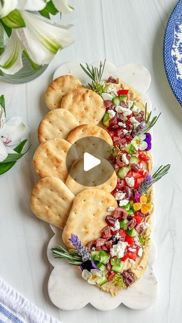 The Board Loon | Kelsey Bassett on Instagram: "Make way for the hummus board! THIS is the appetizer you will want to make for your next event. Start off by spreading the hummus evenly & directly on the board. I used my @pamperedchef spatula- my fave! Next, place some mini @stonefirenaan naan breads along the side and add a drizzle of olive oil. I then topped it with diced tomatoes, cucumbers, kalamata olives and feta cheese. Lastly, garnish! 

✨Follow along for more Charcuterie Boards, Midwest Accents, Tutorials, Recipes & more!
.
📬 : TheBoardLoon@gmail.com 
.
💻 : Www.TheBoardLoon.com
.
. @TheBoardLoon also on TikTok & Facebook
.
 #charcuterie #recipe #tutorial #theboardloon #cheeseboard #tutorial  #charcuterieboard  #appetizers #board #cheese #graze #hummus #hummusboard" Appetizers Board, Hummus Board, Recipe Tutorial, Board Cheese, Diced Tomatoes, Naan Bread, Kalamata Olives, Charcuterie Boards, Diced Tomato