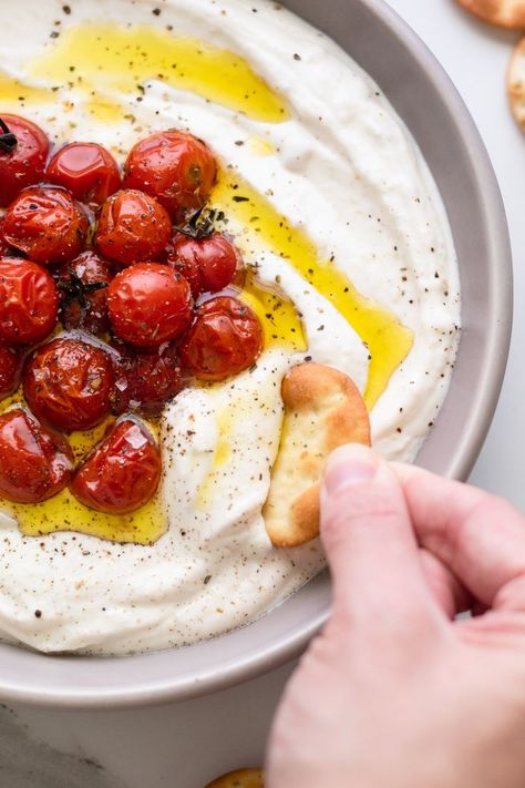 dipping cracker in garnished ricotta dip Whipped Mozzarella Dip With Burst Cherry Tomatoes, Whipped Ricotta With Roasted Tomatoes, Feta Ricotta Dip, Roasted Garlic Whipped Ricotta, Whipped Feta And Ricotta Dip, Savory Whipped Ricotta, Whipped Ricotta And Roasted Tomatoes, Ricotta And Tomatoes, Whipped Mozzarella Dip