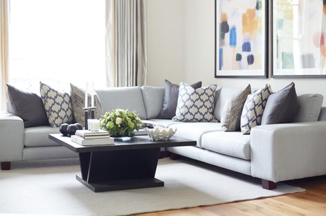 We used this light grey corner sofa to create a relaxed feeling in the reception room of this grade II listed Highgate development. This seating area sat adjacent to a more formal seating arrangement. We used patterned cushions and colourful artwork to create a contrast between the two areas . Scatter Cushions On Corner Sofa, Grey Sofa And Cushions, Grey Corner Sofa Cushion Ideas, Cushions On Corner Sofa, Corner Sofa Cushion Arrangement, Cushions For Light Grey Sofa, Navy Sofa Cushion Ideas, Cushions For Grey Sofa Color Schemes, Light Grey Sofa Cushion Ideas