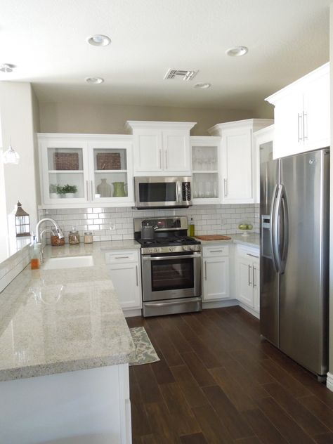 Next house...white cabinets, white backsplash, gray granite and wood tile floors.  Love this remodel. Builder Grade Kitchen, Light Granite, Wood Floor Design, Kabinet Dapur, Herringbone Backsplash, Dark Floors, Future Kitchen, Decor Ikea, White Backsplash