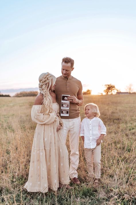 Pregnancy baby announcement photo. Sunset photography, neutral colors, boho dress and braided hair holding ultrasound photos. Family photo shoot Maternity Photography Outfits, Neutral Dress, Announcement Photos, Pregnancy Announcement Photos, Boho Maternity, Baby Announcement Photos, Embroidered Maxi Dress, Pregnancy Reveals, Photo Outfit