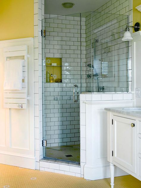 Corner showers can be a great way to make the most of the space in a small bath. This shower adds vintage charm to a new bathroom, thanks to subway tiles with dark grout lines on the walls and hexagonal mosaic tile on the floor. A partial wall enclosure subtly separates the shower from the adjacent vanity area. Small Bathroom With Shower, Shower Tub Combination, Bathroom Tub Shower, Bathroom Shower Design, Bathroom Remodel Shower, Small Bath, Corner Shower, Small Bathroom Design, Bathroom Renos