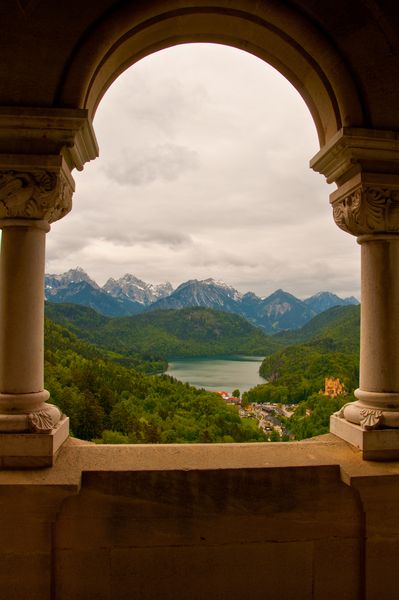 Bavaria - view from Neuschwanstein Castle. Neuschwanstein Castle  is a nineteenth-century Romanesque Revival palace on a rugged hill above the village of Hohenschwangau near Füssen in southwest Bavaria, Germany. The palace was commissioned by Ludwig II of Bavaria as a retreat and as an homage to Richard Wagner. Ludwig paid for the palace out of his personal fortune and by means of extensive borrowing, rather than Bavarian public funds. Munich Aesthetic, Castle Window, Castle Germany, Famous Castles, Germany Castles, Growing Veggies, Neuschwanstein Castle, Aesthetic Board, Dream Trip