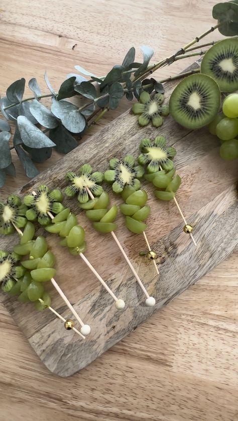 Follow along with our blog and design cutesy kiwi flowers for your charcuterie spread. Impress your guests at your next dinner party with this sweet treat. #charcuterie #charcuterieboard #diyfood #foodart #partyfood Spring Charcuterie, Graze Table, Grape Flower, Charcuterie Food, Fall Charcuterie, Charcuterie Spread, Edible Decorations, Green Grape, A Charcuterie Board