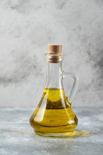 Olive oil bottle on marble table. | Free Photo #Freepik #freephoto #cooking-oil #oil-bottle #olive-oil #oil Vegetable Oil Substitute, Cooking Oil Bottle, Oil Substitute, Salad Vegetables, Castor Oil Packs, Vinegar Dispenser, Vinegar Cruet, Olive Oil And Vinegar, Mustard Oil