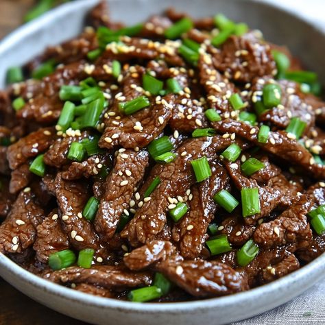 🍖 Savor the authentic flavors of Traditional Korean Bulgogi—marinated beef that's both savory and sweet! 🇰🇷🍴 #Bulgogi #KoreanBBQ Traditional Korean Bulgogi Ingredients: Beef sirloin (1 lb, thinly sliced) Soy sauce (1/4 cup) Brown sugar (2 tbsp) Sesame oil (2 tbsp) Garlic (3 cloves, minced) Ginger (1 tsp, grated) Green onions (2 stalks, chopped) Sesame seeds (1 tbsp) Instructions: In a bowl, mix soy sauce, brown sugar, sesame oil, garlic, ginger, and green onions. Add beef and marinate for... Korean Bulgogi, Instagram Recipes, Bulgogi Beef, Marinated Beef, Beef Sirloin, Bulgogi, Trending Recipes, Korean Bbq, Traditional Korean