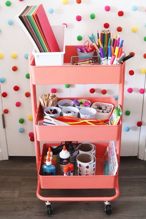 How to Make a Kids Art Cart. Use a three-tiered rolling cart and fill it with arts and craft supplies from Oriental Trading to keep kids occupied at home. Art Rolling Cart, Kid Craft Storage Ideas, Craft Cart For Kids, Three Tier Cart Organization, Kids Art Studio At Home, Stationary Trolley, Arts And Crafts Cart, Art Cart Organization For Kids, Craft Cart Ideas