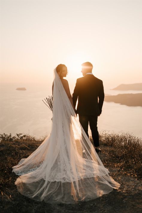 Greece Wedding Photoshoot, Wedding Photo Sunset, Romantic Wedding Photos Aesthetic, Santorini Wedding Photography, Wedding Photo Ideas Bride And Groom Outdoor, Sitting Wedding Poses, Landscape Wedding Photography, Bride And Groom Beach Wedding Photos, Wedding Sunset Photos