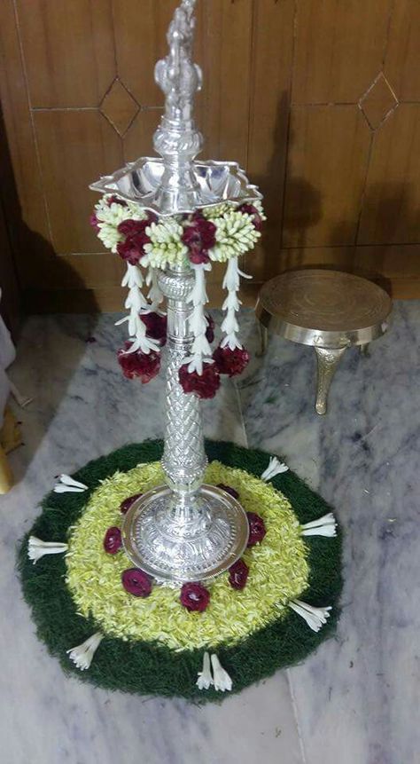 Kuthu Vilaku Decoration With Flowers, Kuthuvilaku Flower Decoration, Kuthu Vilaku Decoration, Samay Decoration, Vilaku Decoration, Deepam Decorations, Indian Floral Decor, Leaf Decor Wedding, Coconut Decoration