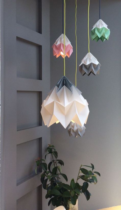 DIY origami lampshades bring light and style to any room. Get started now. Paper Lantern Chandelier, Origami Furniture, Origami Lights, Puzzle Lights, Origami Lampshade, Lampshade Kits, Origami Lamp, Decorative Lamp Shades, Origami Paper Art