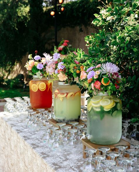 three beverage dispensers are decorated with flowers and spa water Wildflower Cocktail Hour, Spring Wedding Drinks, Diy Wedding Bar Setup, Self Service Bar Wedding, Cocktail Hour Inspiration, Cocktail Set Up, Margarita Bar Wedding, Wedding Water Station, Cocktail Hour Wedding Ideas