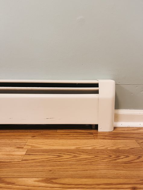 Upgrading Our Dated Baseboard Heaters - Dream Green DIY How To Hide Electric Baseboard Heaters, Baseboard Heating Ideas, Hot Water Baseboard Covers, Baseboard Heaters Decorating Around, Black Baseboards, Hydronic Baseboard Heaters, Baseboard Heaters, Baseboard Heater Covers, Floor Heater