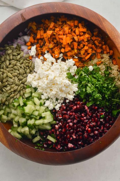 Crunchy kale winter salad with pomegranates, cucumber, pumpkin seeds, feta, parsley, sweet potato, and quinoa. Crunchy Kale Salad, Pomegranate Kale Salad, Kale Sweet Potato Salad, Sweet Potato And Quinoa, Pumpkin Seed Salad, Crunchy Kale, Sweet Potato Salad Recipe, Salad With Pomegranate, Quinoa Kale