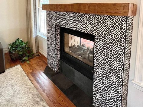 Looking to refresh your fireplace? Check out these 10 modern farmhouse tile ideas for the perfect blend of rustic and contemporary design. Farmhouse Fireplace Tile, Patterned Tile Fireplace, Moroccan Tile Fireplace, Cement Tile Fireplace, Spanish Style Fireplace, Modern Farmhouse Tile, Tile Around Fireplace, Black Fireplace Surround, Fireplace Tile Ideas