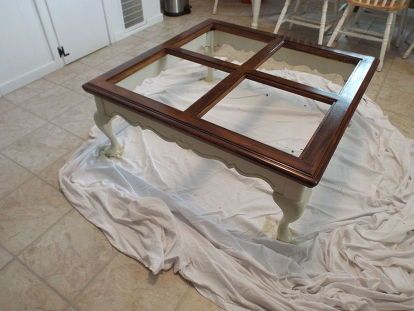 Found an outdated coffee table at the used furniture store for $65 bucks. It was solid oak and had interesting glass cutouts. I immediately knew what I wanted to do with it to make it MINE. Just sitting in the store waiting for me. Look at that glass.... love it. Let the restoration begin.... Primed the bottom and stained top with polyshades Closer look at the primer Coat one of Behr paint Closer look and second coat of paint Wax on Wax off (actually buffed it out wi… Glass Table Redo, Glass Coffee Table Makeover, Coffee Table Makeover Diy, Coffee Table Restoration, Coffee Table Upcycle, Coffee Table Redo, Coffee Table Makeover, Painted Coffee Tables, Furniture Fix