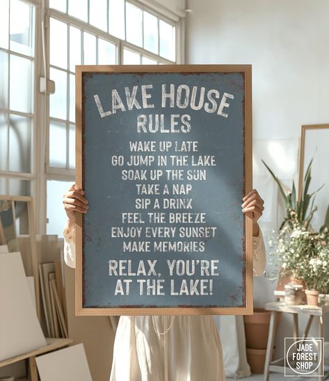 This retro-inspired "Lake House Rules" sign is a unique addition to your lake house wall decor. The vintage lettering and distressed texture add effortless, relaxed style to your modern farmhouse decor. Available printed on canvas, paper, or aluminum, framed or unframed, these make wonderfully thoughtful gifts!  SIZES  Choice of 8" x 12", 12" x 18", 20" x 30", 24" x 36", or 32" x 48"  MATERIALS  CANVAS -- Printed on smooth, clay-coated canvas, and gallery-wrapped over a 3/4" deep wood frame. Can Lake Theme Living Room, Fishing Lodge Decor Lake Cabins, Americana Lake House Decor, Lake House Artwork, Small Lake House Interior, Lakehouse Kitchen Ideas, Small Lake Cottage Interiors, Lake House Rules Sign, Lake House Bathroom Ideas