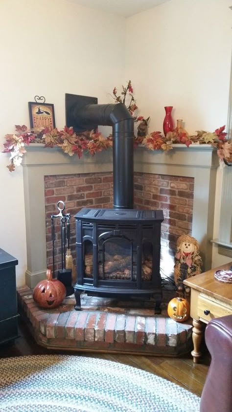 Mantel With Wood Stove, Corner Wood Stove Mantle, Wood Stove Tv Above, Corner Stove Fireplace Ideas, Wood Burning Stove Corner Ideas, Corner Wood Stove Mantel, Wood Stove Tv Wall, Corner Wood Stove Mantel Ideas, Corner Log Burner Ideas Living Room