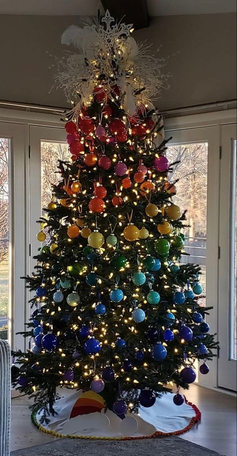 Rhonda Browning painted every ornamet herself. She made the color wheel tree skirt as well. 🌈❣️ Multo Colored Christmas Tree, Christmas Tree Ideas Rainbow Lights, Rainbow Pride Christmas Tree, Christmas Tree Rainbow Lights, Silver Tree With Multi Colired Lights, Gay Christmas, Rainbow Christmas Tree, Rainbows Christmas, Creative Christmas Trees