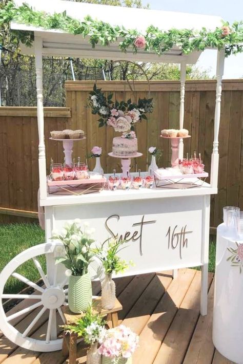 Feast your eyes on this beautiful floral sweet 16! The dessert table cart is fab!! See more party ideas and share yours at CatchMyParty.com #catchmyparty #partyideas #sweet16 #sweetsixteen #floralparty #girlbirthdayparty Sweet 16 Party Centerpieces, Sweet 16 Yard Decorations, Sweet 16 In Backyard, Rustic Sweet 16 Party Ideas Decoration, Sweet 16 Outdoor Decorations, Sweet 16 Decorations Outdoor, Whimsical Sweet 16 Party Ideas, Sweet Sixteen Backyard Party Ideas, Dessert Table Sweet 16