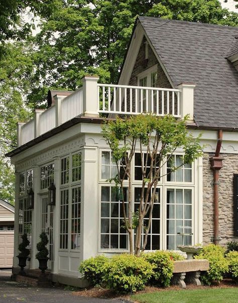 Beautiful sunroom with rooftop deck. This two-in-one feature is both pretty and practical. House With Lots Of Windows, Real Estat, Lots Of Windows, Rooftop Deck, Sunrooms, White Trim, Design Case, Home Fashion, 인테리어 디자인