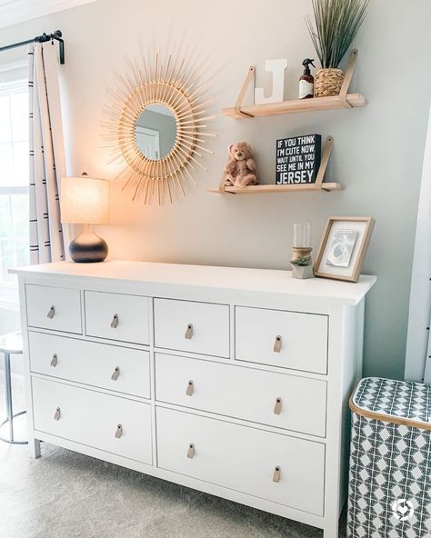 Ikea Hemnes dresser in Nursery with leather pulls by One Dream Two Sisters on Instagram Toddler Dresser With Mirror, Nursery Floating Shelves Over Dresser, Nursery Shelves And Mirror, Dresser And Floating Shelves, Ikea Dresser With Mirror, Ikea Baby Dresser, Floating Shelves Over Dresser, Floating Shelf Above Dresser, Floating Shelves For Nursery