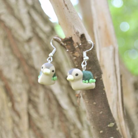 If you, like me, enjoy cartoons watching, then these earrings are made for you) Cute turtle duck right on your ears. High of earrings(with hooks) is about 3.5 cm (1.37 inches). You can choose hooks(like on photo) and sterling silver hooks. Thanks for visiting my little shack, hope you come back) Clay Ideas Duck, Clay Turtle Earrings, Duck Clay Earrings, Duck With Knife Earrings, Frog Earrings Aesthetic, Turtle Polymer Clay, Turtle Duck, Cartoon Earrings, Indie Earrings