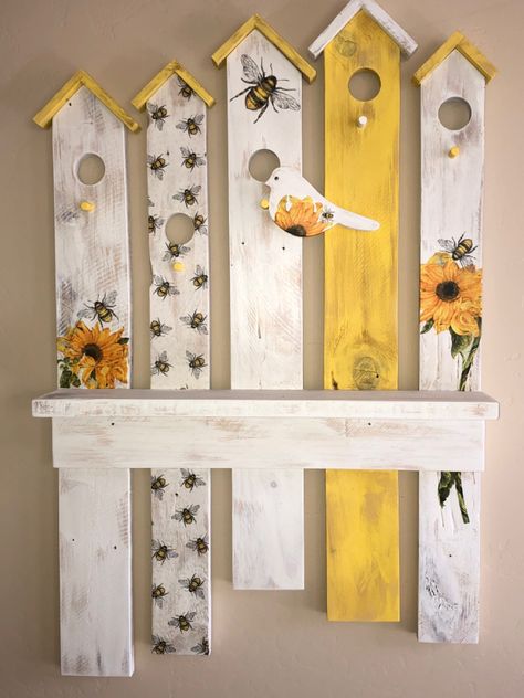 This one-of-a-kind piece would add charm to any room in your home! Picket Fence Welcome Sign, Cute Birdhouses Painted Ideas, Summer Pallet Ideas, Birdhouse Signs, Spring Wooden Crafts, Old Fence Board Projects, Wall Decor With Shelf, Barn Board Crafts, Picket Fence Crafts