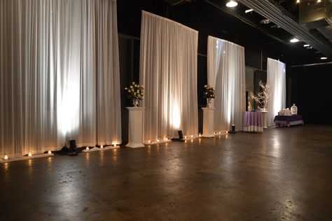 Outer walls highlighted with illuminated draping panels around the room. Watch as we go from white for the ceremony and change color for the reception. ~Draping by Events Plus Nashville. #Wedding #reception #draping #Venue #transformation #decorations #lighting Banquet Hall Wedding Decor Draping, White Draped Walls Wedding, White Curtains Wedding Draping, Chiffon Wall Draping, Wedding Wall Drapery Ideas, Wall Drapping Ideas, Drape Walls For Party, Draping Walls For Wedding, Party Drapery Ideas